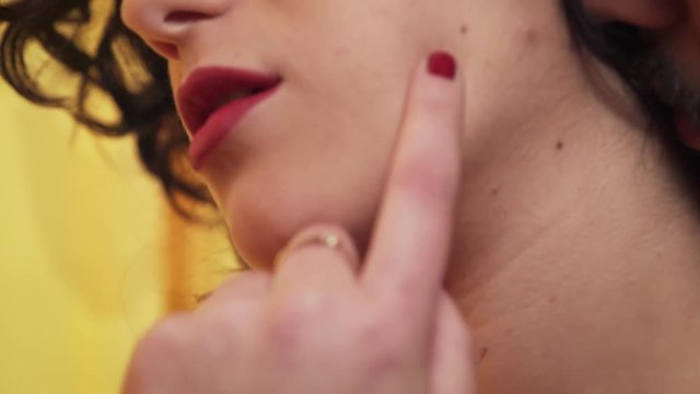 Passion and sex: hot woman helps her man touching sensually her body