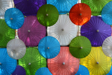 Fototapeta na wymiar Colorful Paper umbrella handmade umbrella, Colorful umbrellas background