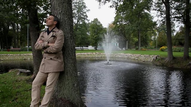 Cinema graphic. Autumn park in Riga, fountain. Only bicycle is riding on background