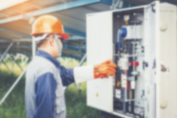 an engineer working on checking and maintenance equipment in solar power plant