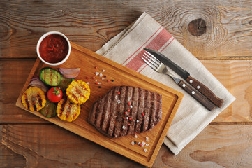 beef steak grilled with grilled vegetables