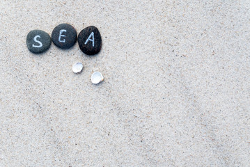 Fototapeta na wymiar stones on the sand background
