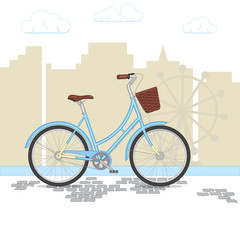 Blue retro bicycle with basket on city background