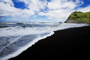 Black sand beach at Pololu Beach coastline at North Kohala, Big Island, Hawaii