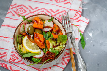 Steamed sweet potato, broccoli and other vegetables salad in the bowl. Love for a healthy vegan food concept
