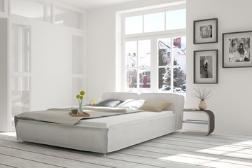 White bedroom with winter landscape in window. Scandinavian interior design