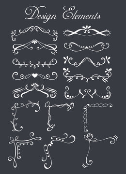 Set of hand drawn design elements (text dividers and corners) isolated on chalkboard.