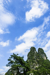 Obraz premium Karst mountains and rural scenery in summer