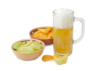 Lager beer and two various potato chips in ceramic bowls