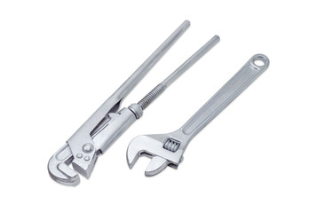 Plumber wrench and adjustable wrench on a light background