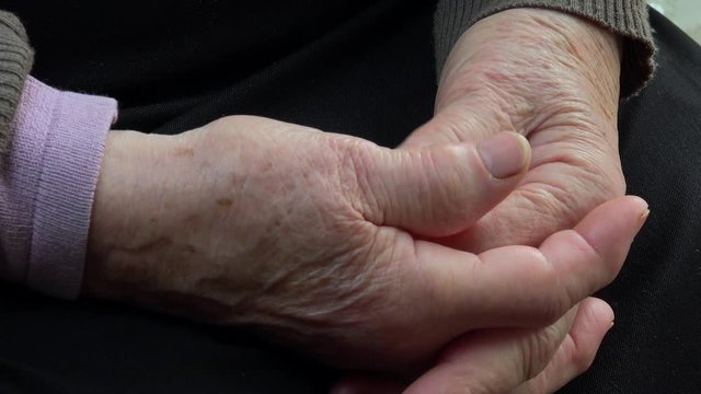 detail of hands of elderly woman