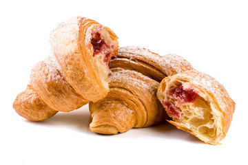 croissant and half with cherry jam powdered sugar isolated on white background closeup