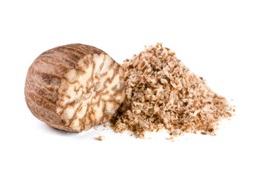 one nutmeg and powder isolated on white background