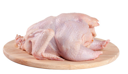 raw chicken carcass on the cutting board isolated on white background