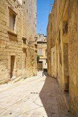 Fototapeta na wymiar The narrow street of the old capital Vittoriosa (Birgu), Malta