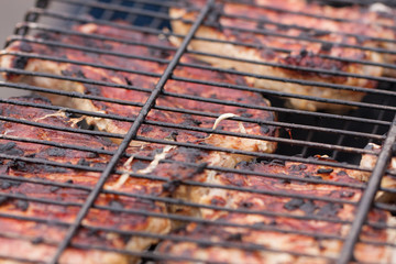 Grilling skewers or shashlik on barbecue grill. Selective focus
