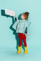 Little girl posing in fashion style wearing autumn clothing.