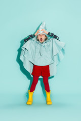 Little girl posing in fashion style wearing autumn clothing.