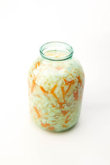 Sour cabbage in a glass jar isolated on white background