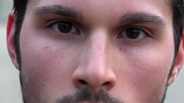detail of a pensive, beautiful man eyes