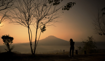 Woman see the sunrise,Image retro tone