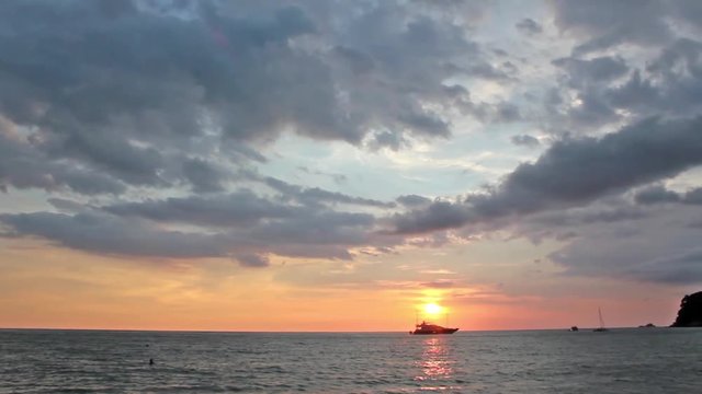 Ocean sunset with beautiful sky and luxury yacht silhouette