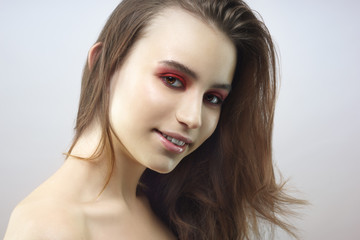 Gorgeous young woman wearing colorful make-up