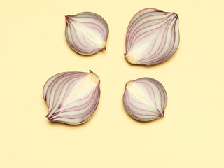 Red onion on a yellow background