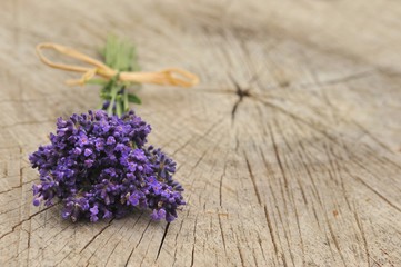 Lavender flowers on wooden background.