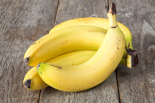 Bananas on grey wooden background