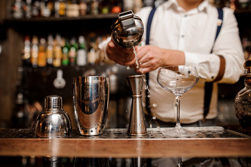 bartender making coctail at the bar counter