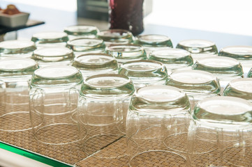 Many clean glasses on bamboo mat