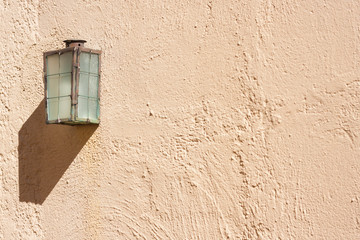 vintage lamp on outdoor textured wall