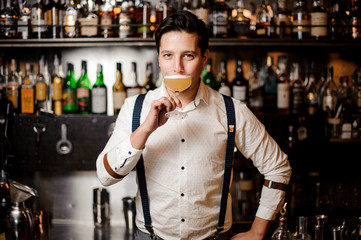 bartender in white shirt with coctail