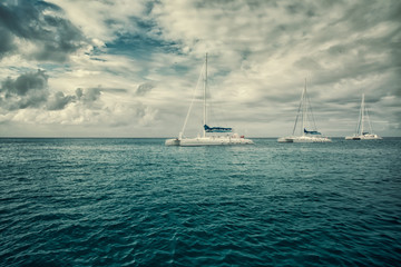 Fototapeta premium three sailboats in the sea