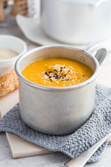 spicy pumpkin cream soup in mug