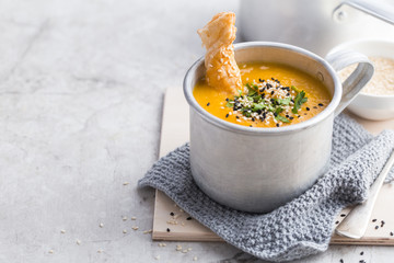 spicy pumpkin cream soup in mug