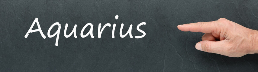 Obraz premium Aquarius on a blackboard. Zodiac signs