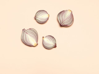 Fototapeta premium Red onion on a yellow background