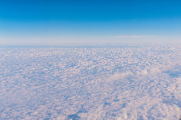 Blue sky with cloud, airplane view.
