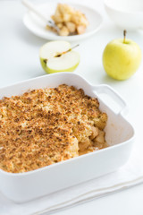 apple crumble pie in white baking dish