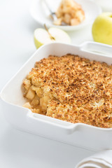 apple crumble pie in white baking dish