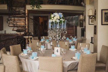 floral composition as decoration on the table at wedding reception