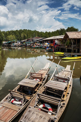 Old wooden boat in the fishing village south-east Asia