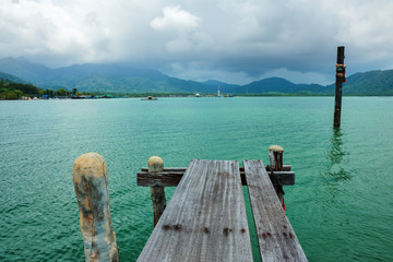 Wooden jetty on exotic beach Koh Chang island, Thailand