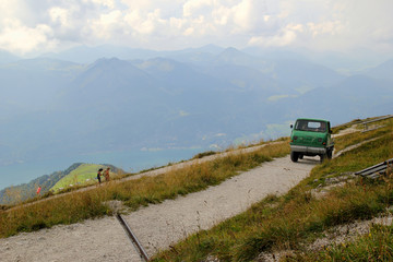 Travel to Sankt-Wolfgang, Austria. The road with view on the mountains and a lake in the clouds.