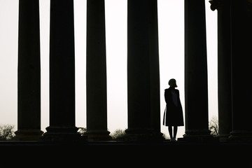 Silhouette of a Young woman in the street.