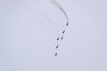 Air show in the sky above the Krasnodar airport flight school. Airshow in honor of Defender of the Fatherland. MiG-29 in the sky.