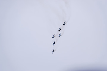 Air show in the sky above the Krasnodar airport flight school. Airshow in honor of Defender of the Fatherland. MiG-29 in the sky.