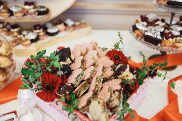 delicious colorful cookies and cakes on the wedding candy bar